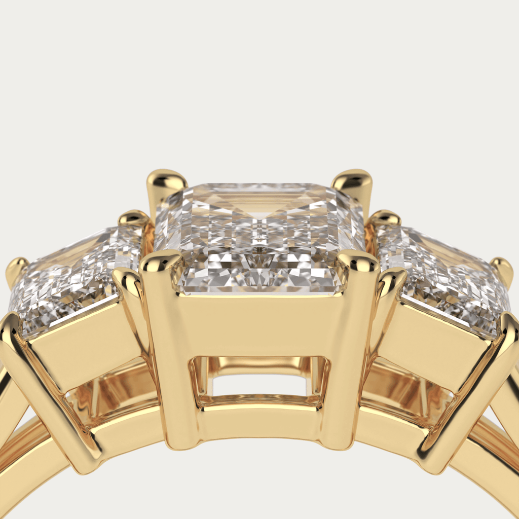 Trestensring med emerald cut diamanter i 18 karat guld og GIA certifikat